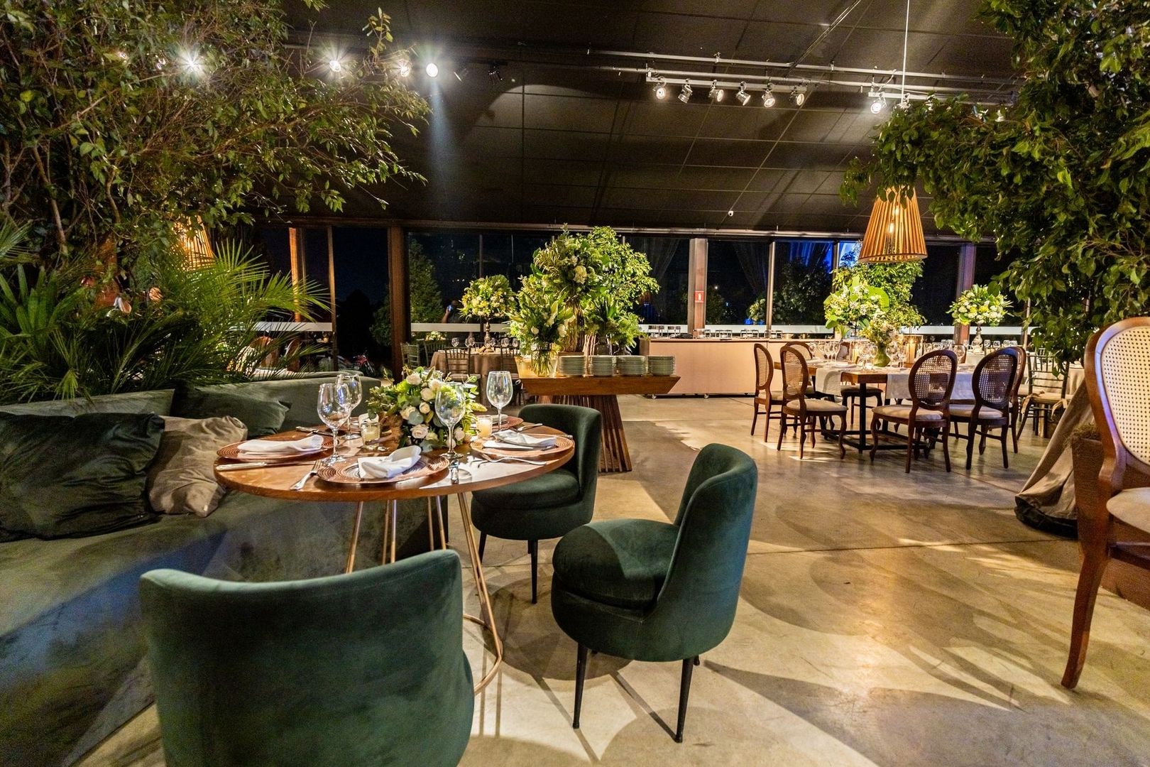 Intimate restaurant lounge with clustered seating and floral tables